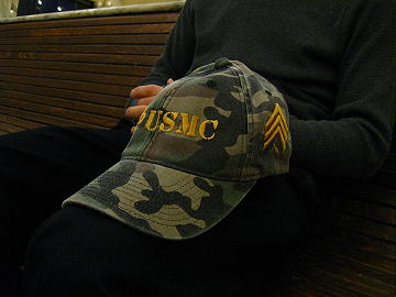 Yupoong Flexfit Camouflage Cap with USMC in "stencil" font, Fleur de lis and Sergeant Chevrons with "puff" embroidery in Ginger thread color.