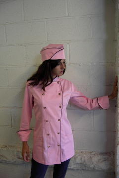 Women's Chef Coat Style BSW100: Shown in Mountain Rose, 100% certified organic cotton, two side hip pockets, brown piping (collar, cuffs & fronts), tiger shell buttons & shown with over seas cap with brown piping.